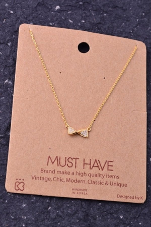 Rhinestone trim bow pendant necklace.