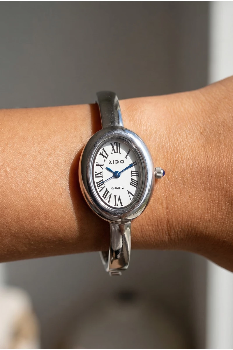 Roman Numeral Oval Dial Bangle Cuff Watch