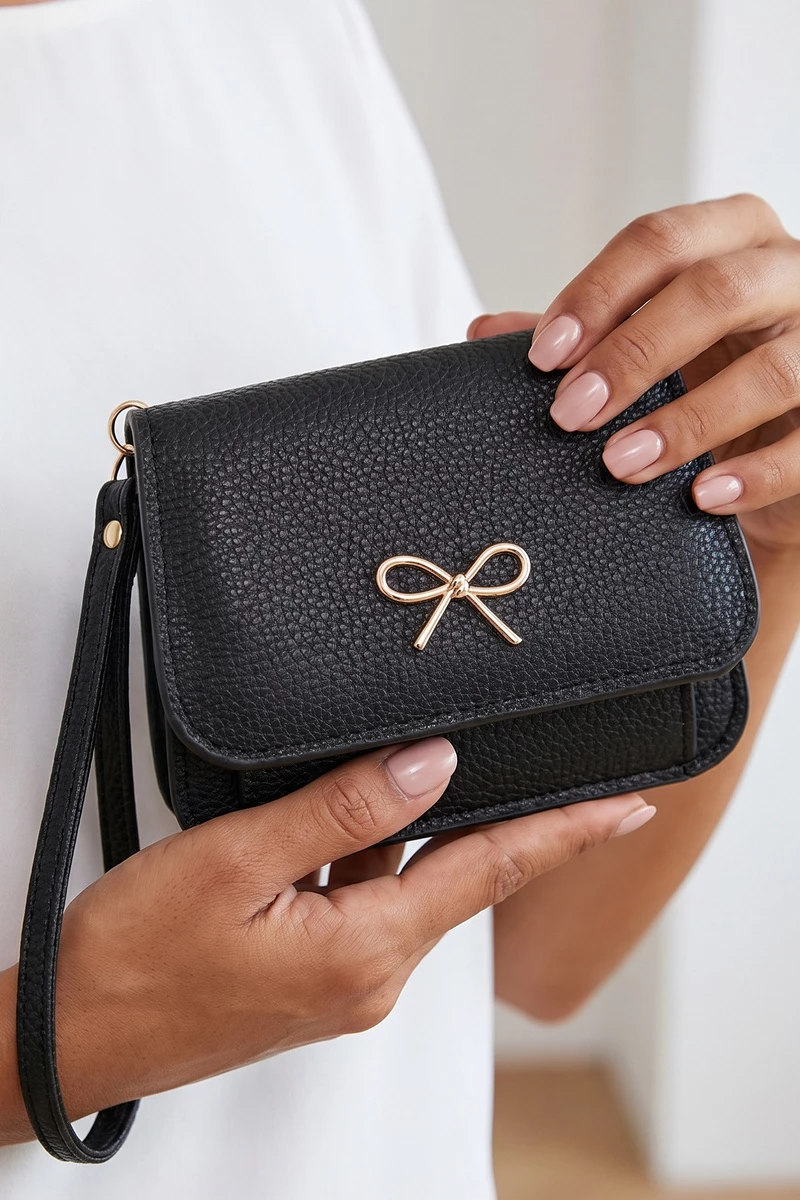 Bow Charm Vegan Leather Flap Wristlet