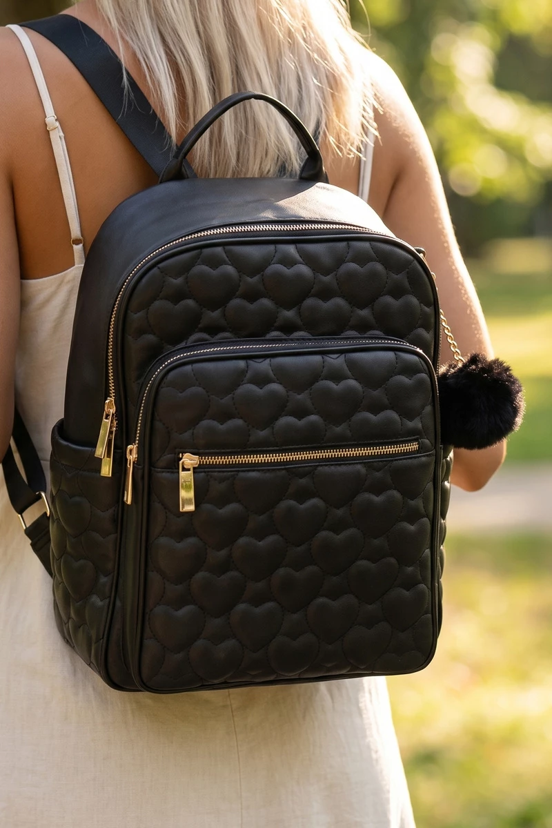 Allover Heart Quilted Pom Backpack