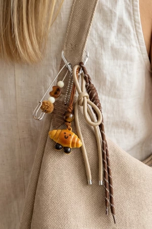 Safety Pin And Ceramic Croissant Bag Charm
