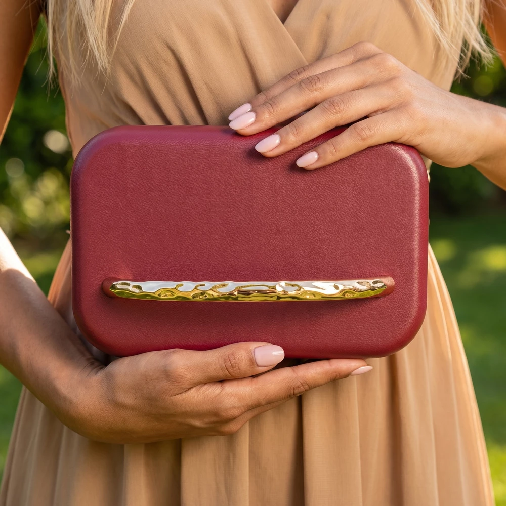 Rounded Hard Case Clutch With Ornate Metal Bar