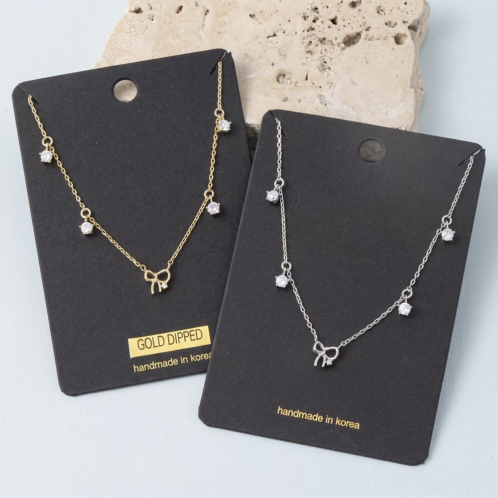Gold Dipped Bow Pendant Necklace With Cz Drops